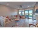 Spacious living room with large windows and fireplace at 92 Stone Bluff Ln, Henderson, NV 89011