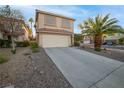 Two-story house with attached garage and desert landscaping at 179 Andada Dr, Henderson, NV 89012