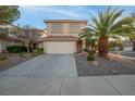 Two-story house with attached garage and nicely landscaped yard at 179 Andada Dr, Henderson, NV 89012