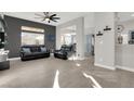 Bright living room, hardwood floors, view into kitchen at 22 Arborfield Ct, Henderson, NV 89012