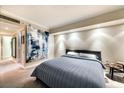 Comfortable bedroom with large abstract art and plush bedding at 2877 Paradise Rd # 1705, Las Vegas, NV 89109