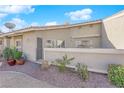 Backyard view featuring a patio, gravel pathway and desert landscaping at 3236 Mystic Ridge Ct, Las Vegas, NV 89129