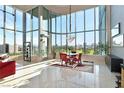 Open concept dining area with city views and modern chandelier at 360 E Desert Inn Rd # 1201, Las Vegas, NV 89109