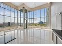 High-rise living room with floor-to-ceiling windows and city views at 360 E Desert Inn Rd # 1201, Las Vegas, NV 89109