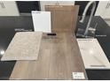 Kitchen and bathroom material samples including cabinetry, flooring, and countertops at 4205 Yucca Brevi Ave, Las Vegas, NV 89139