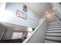 Modern staircase with gray and white accents at 4358 Raynham St, Las Vegas, NV 89115