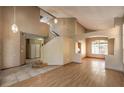 Bright entryway with tiled floors and staircase at 4861 Camino Sombrero, North Las Vegas, NV 89031