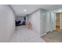 Bright hallway with tile flooring leading to living areas at 5124 Brownwood Ave, Las Vegas, NV 89122