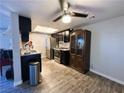 Modern kitchen with dark cabinets and granite countertops at 5320 Duralite St # 102, Las Vegas, NV 89122