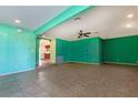 Living room with tile floors, and view into kitchen at 6229 Cromwell Ave, Las Vegas, NV 89107