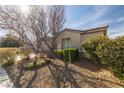 Landscaped yard with gravel and drought-tolerant plants at 6436 Emerson St, Pahrump, NV 89048