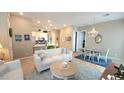 Open concept living and dining area with hardwood floors at 746 Agave Falls St, Henderson, NV 89011