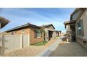 Landscaped side yard with walkway and privacy fence at 746 Agave Falls St, Henderson, NV 89011