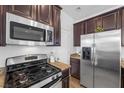 Stainless steel appliances and granite countertops in kitchen at 8322 Rygate Ave, Las Vegas, NV 89178