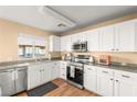 Clean kitchen, featuring stainless steel appliances and white cabinetry at 8437 Sluman Ct, Las Vegas, NV 89128