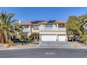 Two-story house with solar panels and three-car garage at 9113 Harvest Homes St, Las Vegas, NV 89123