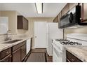 Modern kitchen with granite countertops and stainless steel appliances at 950 Seven Hills Dr # 2413, Henderson, NV 89052