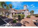 Spanish-style home with covered parking and desert landscaping at 1431 Di Blasi Dr # 105, Las Vegas, NV 89119
