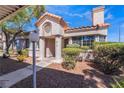 Charming stucco home with a Spanish-style design and well-maintained landscaping at 1431 Di Blasi Dr # 105, Las Vegas, NV 89119