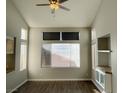 Living room with hardwood floors, high ceilings, and large windows at 2503 Lady Elizabeth Ct, North Las Vegas, NV 89031