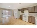 View of kitchen with white appliances and ample cabinet space at 6413 Ironbark Ln, Las Vegas, NV 89107