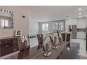 Modern dining room with a view of the kitchen and living room at 6788 Lavender Sky Ct, Las Vegas, NV 89142