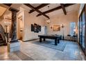 Game room featuring a pool table, high ceilings, and elegant tile floors at 7501 Midnight Rambler St, Las Vegas, NV 89149