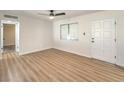 Living room featuring hardwood floors and a white door at 1408 Palm St, Henderson, NV 89011