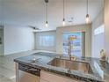 Stylish kitchen with stainless steel appliances, granite countertops, and modern pendant lighting at 1510 Fieldbrook St, Henderson, NV 89052