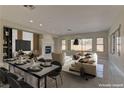 Virtually staged dining area with modern table and chairs at 1656 Black Fox Canyon Rd, Henderson, NV 89052