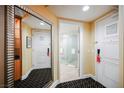 Hotel room entryway with mirror, bathroom access, and built-in shelving at 2000 Fashion Show Dr # 2615, Las Vegas, NV 89109