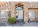 White front door entry with stonework and landscaping at 2000 White Falls St, Las Vegas, NV 89128