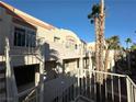 Two-story building with balconies and palm trees offering a desirable residential setting at 2076 Mesquite Ln # 302, Laughlin, NV 89029