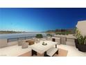 Waterfront patio with seating and fire pit at 28 Heron Harbour Dr, Henderson, NV 89011