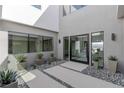 Modern entryway with plants and a glass door at 29 Falling Ridge Ln, Henderson, NV 89011