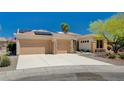 House with three-car garage, solar panels and desert landscaping at 3004 Canton Hills St, Henderson, NV 89052