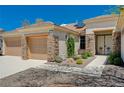 House with three-car garage and decorative iron entry gate at 3004 Canton Hills St, Henderson, NV 89052