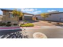 Front view of a single-story house with a two-car garage at 4509 Glossier Ave, North Las Vegas, NV 89084