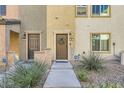 Townhome entrance with landscaping and walkway at 4650 Ranch House Rd # 42, North Las Vegas, NV 89031