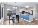 Bright dining area with a round table and four chairs near the kitchen at 4921 Black Bear Rd # 104, Las Vegas, NV 89149