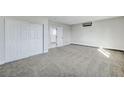 Bright bedroom with plush carpet and double door closet at 6252 Fairwood Ave, Las Vegas, NV 89107