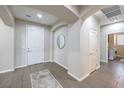 Bright and airy entryway with tile flooring and neutral color palette at 6288 Starflare St, Las Vegas, NV 89148