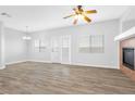 Bright living room with sliding glass doors and wood-look floors at 6637 Lookout Lodge Ln # 2, North Las Vegas, NV 89084