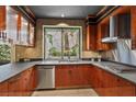 Stylish kitchen featuring stainless steel appliances, custom cabinets, and tiled flooring at 8199 Pinnacle Peak Ave, Las Vegas, NV 89113