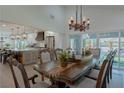 Elegant dining room with a large table and access to kitchen at 836 San Eduardo Ave, Henderson, NV 89002