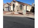 Single-story home with landscaped yard and driveway at 9016 Gabro Ln, Las Vegas, NV 89123