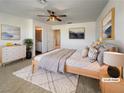 Spacious primary bedroom with plush carpet and wood-toned furniture at 12124 Mojave Gold Rd # 2, Las Vegas, NV 89183