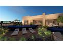 Modern home with a sleek, infinity-edge pool and relaxing lounge area at 129 Still Shores St, Henderson, NV 89011