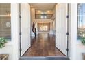 Two-story entry with hardwood floors and open staircase at 1559 Via Della Scala, Henderson, NV 89052