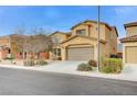 Two-story house with a large garage and landscaping at 1836 La Calera Ave, North Las Vegas, NV 89084